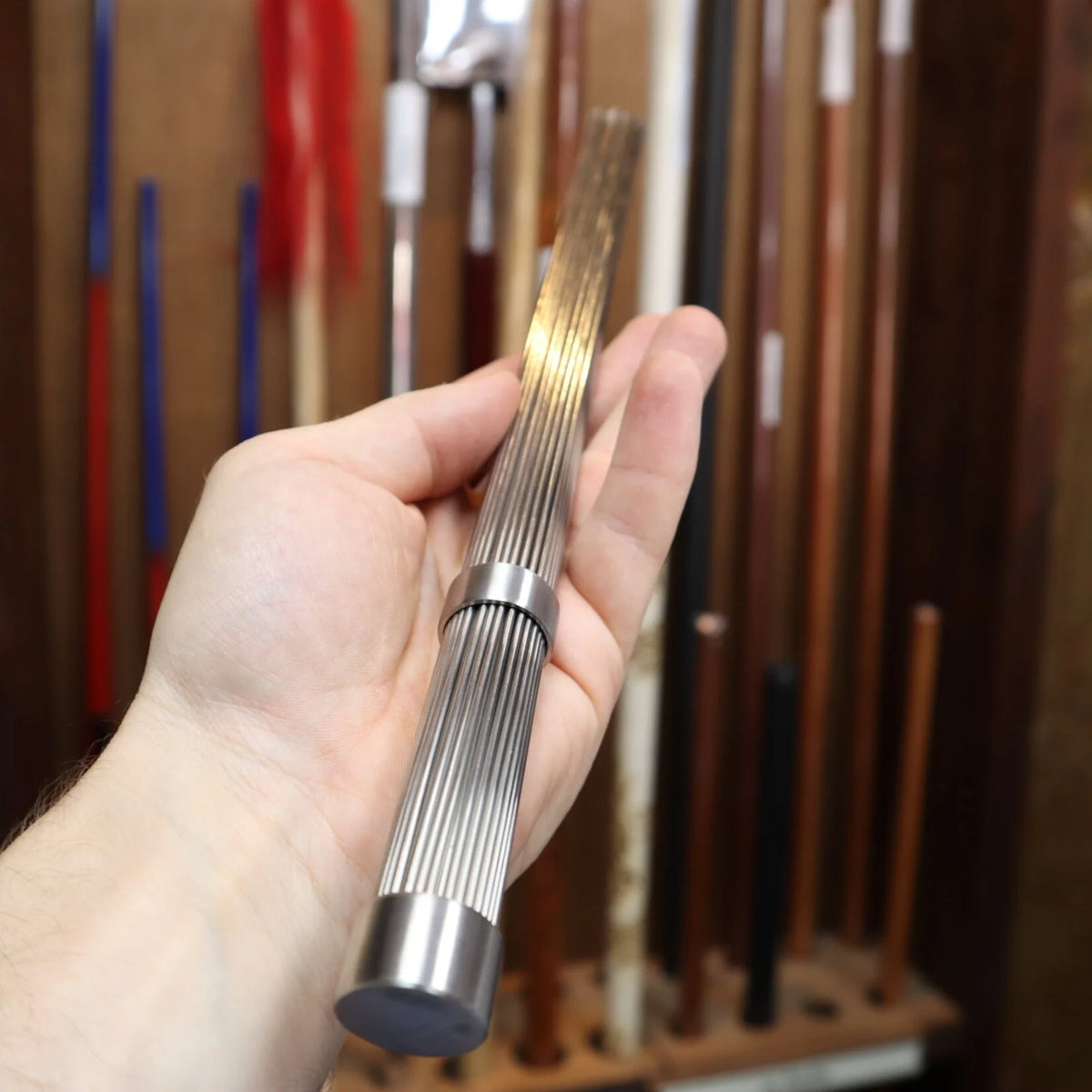 qi gong metal massage brush in hand 2